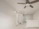 Open loft area with neutral carpet and white walls with a ceiling fan in the background at 619 Brennan Cir, Erie, CO 80516