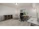 Cozy home office space with natural light, a comfortable chair, and modern desk setup at 619 Brennan Cir, Erie, CO 80516