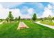 Picturesque community open space with horseshoe pit, walking paths, and manicured lawns at 619 Brennan Cir, Erie, CO 80516