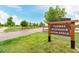 Thomas Reservoir Open Space sign with grassy fields, walking paths, and community amenities at 619 Brennan Cir, Erie, CO 80516