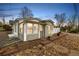 Charming home featuring manicured rock landscaping and a cozy, inviting entrance at dusk at 3001 Benton St, Wheat Ridge, CO 80214