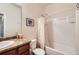 Cozy bathroom with a shower-tub combo, vanity with cultured marble countertop at 1820 Taos St, Brighton, CO 80603