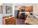 Modern kitchen with wood cabinets, stainless steel appliances, and ample counter space at 1820 Taos St, Brighton, CO 80603