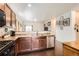 Spacious kitchen featuring stainless steel appliances, wood cabinets and a breakfast bar at 1820 Taos St, Brighton, CO 80603