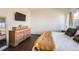 Comfortable main bedroom featuring wood floors, a dresser, and natural light, creating a cozy retreat at 1820 Taos St, Brighton, CO 80603