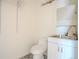 Modern powder room featuring a sleek vanity, toilet, and patterned tile flooring at 722 W 6Th Ave, Denver, CO 80204