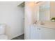Bathroom with modern vanity, mirror, and open shelf linen closet at 722 W 6Th Ave, Denver, CO 80204