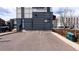 Parking in front of a condo; complex has dark gray horizontal siding at 722 W 6Th Ave, Denver, CO 80204