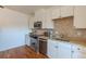 Charming kitchen with stainless steel appliances and white cabinets, offering a clean design at 722 W 6Th Ave, Denver, CO 80204