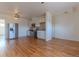 Spacious open-concept kitchen with hardwood floors and modern stainless steel appliances at 722 W 6Th Ave, Denver, CO 80204