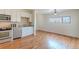 Open-concept kitchen with stainless appliances and a seamless flow to the dining area, great for entertaining at 722 W 6Th Ave, Denver, CO 80204