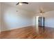 Open living area with hardwood floors and ceiling fans, offering flexibility for various layouts at 722 W 6Th Ave, Denver, CO 80204