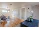 Bright living room with hardwood floors, a comfortable sofa, and access to bathroom at 722 W 6Th Ave, Denver, CO 80204