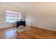 Bright living room with hardwood floors, large window, and modern decor at 722 W 6Th Ave, Denver, CO 80204