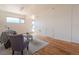 Spacious living area featuring hardwood floors, a comfortable sofa, and plenty of natural light at 722 W 6Th Ave, Denver, CO 80204