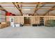 Interior view of barn featuring hay bales and wood beam framing and concrete floor at 5537 Lake Gulch Rd, Castle Rock, CO 80104