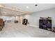 Finished basement featuring plush carpeting, neutral paint, wood beam accent and lots of light at 5537 Lake Gulch Rd, Castle Rock, CO 80104