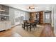 Charming dining area featuring a wood-accent wall, rustic furniture, and sliding glass doors at 5537 Lake Gulch Rd, Castle Rock, CO 80104