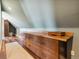 Spacious upper hallway features custom built-in cabinets and wood-look flooring, perfect for storage and organization at 5537 Lake Gulch Rd, Castle Rock, CO 80104