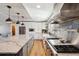 Well-appointed kitchen featuring granite counters, stainless appliances, and a large eat-in island at 5537 Lake Gulch Rd, Castle Rock, CO 80104