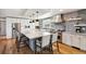 Open kitchen featuring granite island, stainless steel appliances, and wood floors at 5537 Lake Gulch Rd, Castle Rock, CO 80104