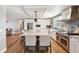 Spacious kitchen featuring stainless steel appliances, a granite island, and wood floors at 5537 Lake Gulch Rd, Castle Rock, CO 80104