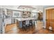 Bright kitchen featuring a large island with seating, stainless appliances, and breakfast nook at 5537 Lake Gulch Rd, Castle Rock, CO 80104
