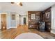 Bright living room with hardwood floors, wood accent wall and a fireplace at 5537 Lake Gulch Rd, Castle Rock, CO 80104