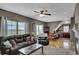 Inviting living room with comfortable seating, ceiling fan, and natural light creating a relaxing atmosphere at 5537 Lake Gulch Rd, Castle Rock, CO 80104