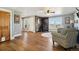 Inviting living room featuring hardwood floors, wood accent wall, and scenic views at 5537 Lake Gulch Rd, Castle Rock, CO 80104