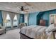 Spacious main bedroom with scenic views, comfortable seating area, and soothing color palette at 5537 Lake Gulch Rd, Castle Rock, CO 80104