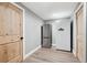 Pantry features wood door, wood-look floors, stainless steel fridge, and additional white refrigerator at 5537 Lake Gulch Rd, Castle Rock, CO 80104