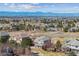 Aerial view of home and neighborhood with mountain views at 6503 S Quemoy Way, Aurora, CO 80016