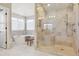 Spa-like bathroom with walk-in shower and soaking tub creating a relaxing retreat at 6503 S Quemoy Way, Aurora, CO 80016