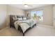 Cozy bedroom with natural light and neutral decor at 6503 S Quemoy Way, Aurora, CO 80016