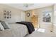 Bright bedroom with ceiling fan, large window and neutral decor at 6503 S Quemoy Way, Aurora, CO 80016