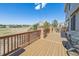 Expansive deck overlooking golf course with brick railing and outdoor grill at 6503 S Quemoy Way, Aurora, CO 80016