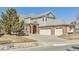 Beautiful two-story home featuring a three-car garage and a well-maintained yard with mature trees at 6503 S Quemoy Way, Aurora, CO 80016