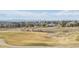 Scenic view of a beautiful home overlooking a lush green golf course at 6503 S Quemoy Way, Aurora, CO 80016