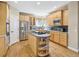 Well-equipped kitchen with stainless steel appliances, a center island, and plenty of cabinet space at 6503 S Quemoy Way, Aurora, CO 80016