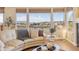 Bright living room with floor to ceiling windows offering beautiful scenic views at 6503 S Quemoy Way, Aurora, CO 80016