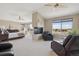 Expansive main bedroom featuring a fireplace, sitting area, and large windows at 6503 S Quemoy Way, Aurora, CO 80016