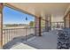 Spacious covered patio with golf course views at 6503 S Quemoy Way, Aurora, CO 80016