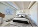 This bedroom offers a large window, modern black and white decor, and plenty of closet space at 1180 Yosemite St # 110, Denver, CO 80220