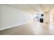 Open-concept living area with hardwood floors and modern kitchen with white cabinetry at 1180 Yosemite St # 110, Denver, CO 80220