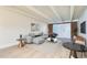 Bright living room features a modern sectional sofa, stylish decor, and ample natural light at 1180 Yosemite St # 110, Denver, CO 80220