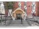 Building entrance with landscaping and stairs at 1008 N Corona St # 204, Denver, CO 80218