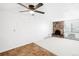 Living room with ceiling fan and brick fireplace at 1008 N Corona St # 204, Denver, CO 80218