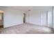 Bright bedroom featuring neutral carpet, fresh paint, and closet space at 15285 Milwaukee St, Thornton, CO 80602