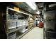 Organized basement storage space with metal shelving units providing ample storage solutions at 1128 S Duquesne Cir, Aurora, CO 80018